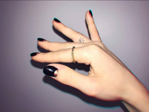An image of Dove Cameron's tattoo on her ring finger